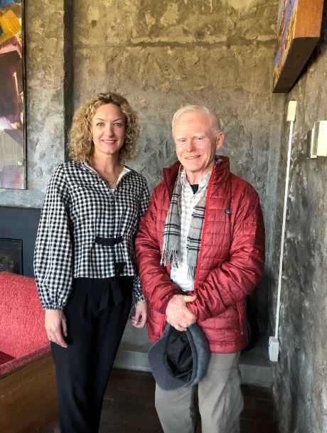 Bruce Kennedy and Lee Hays standing in Alumni House
