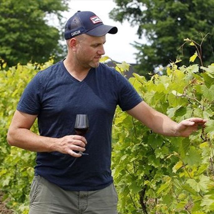 Jonathan Drew walking in his vineyard