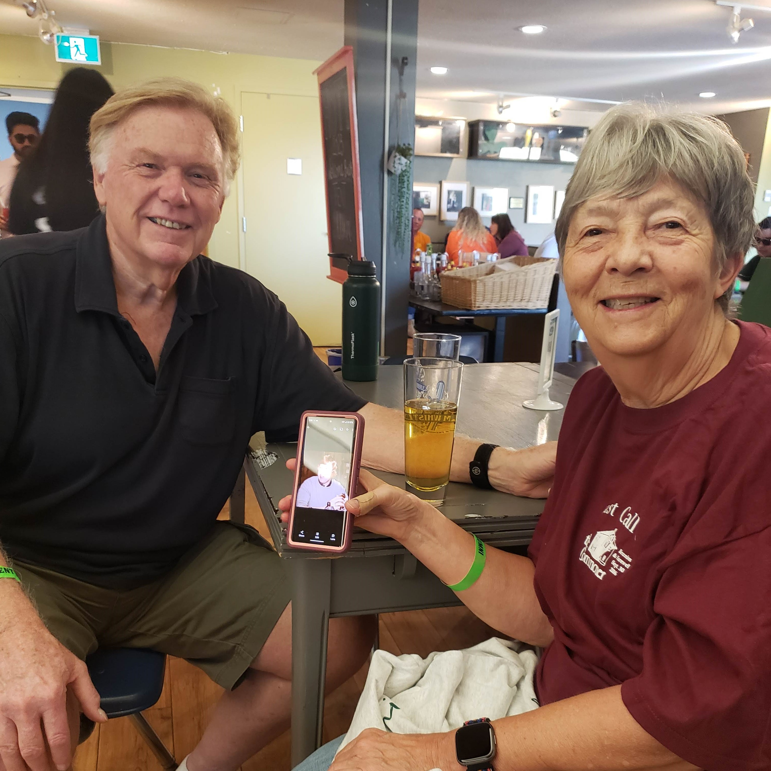 Two alumni sitting at a table