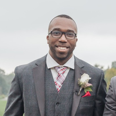 Roderic Southwell smiling at camera in a suit