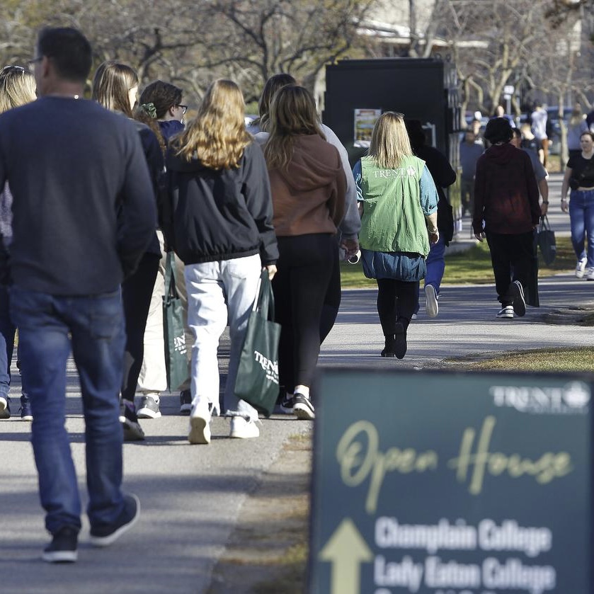 People walking on campus during open house.