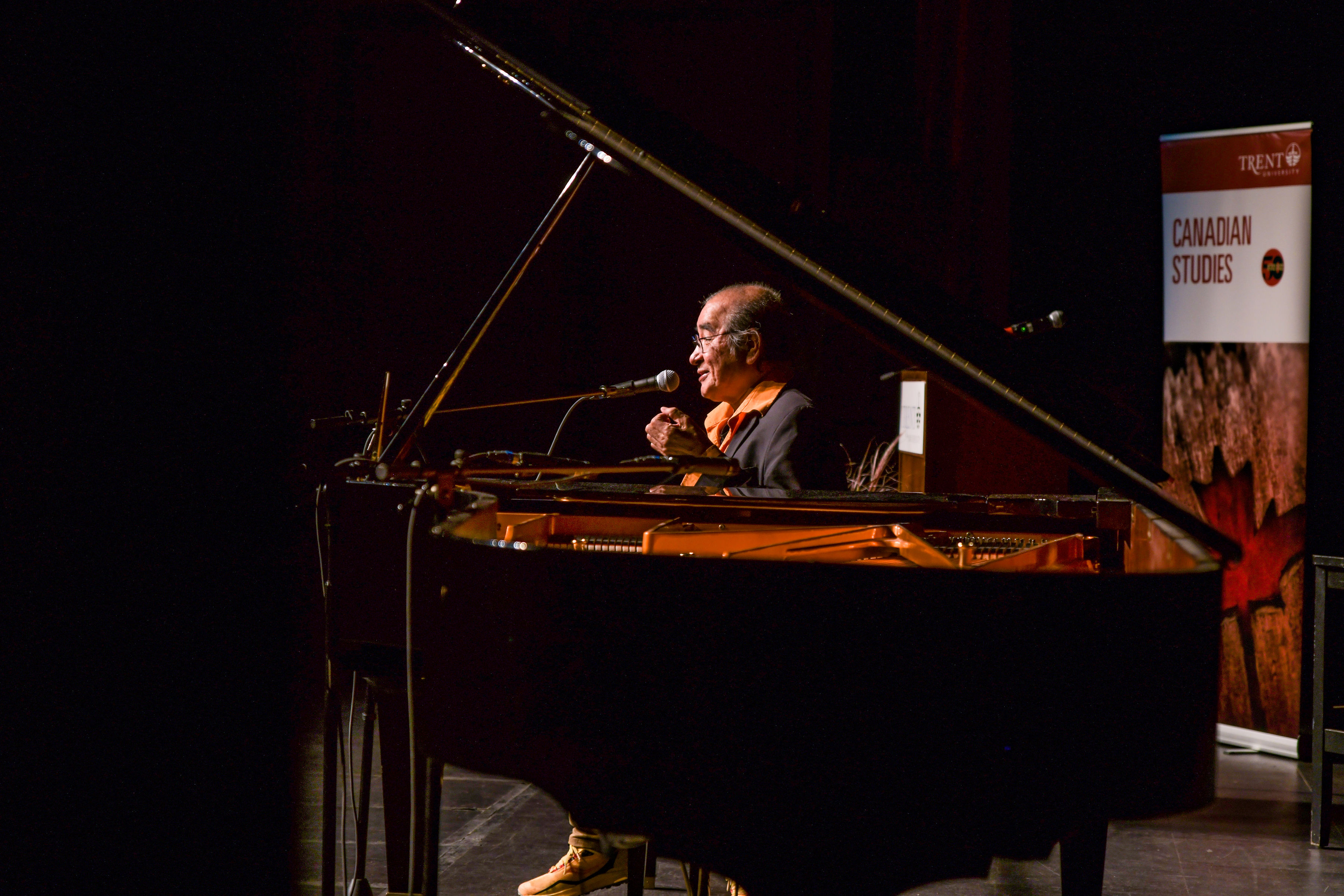Tomson Highway at a piano.