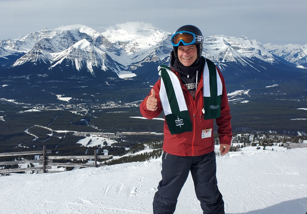 Bern Kelly in front of a snowy mountain