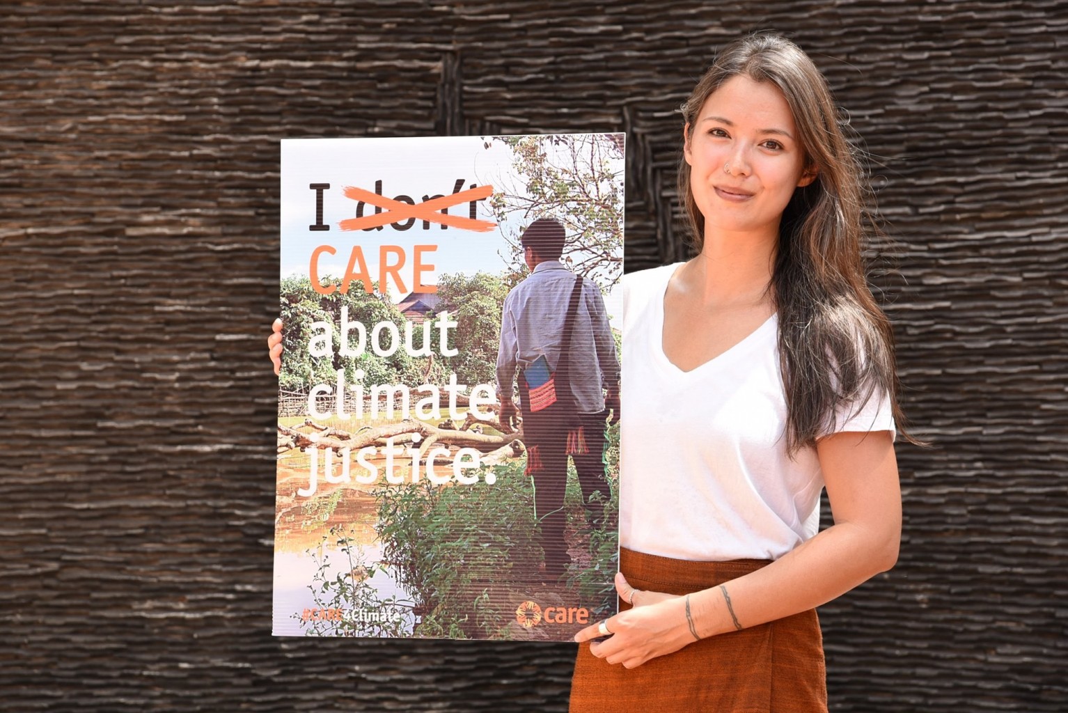 Elizabeth Thipphawong with climate change sign