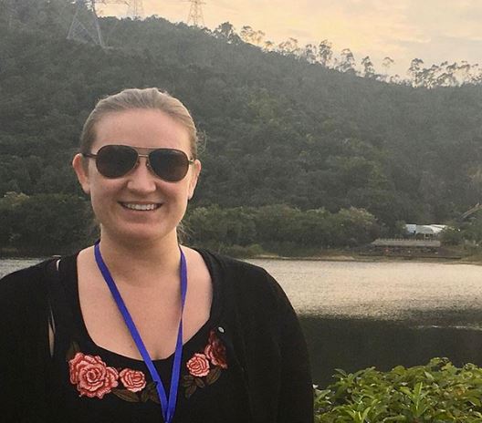 Erika Crowley standing infront of a body of water