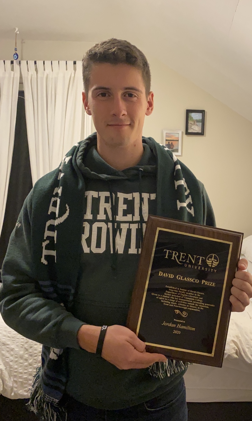 jordan hamilton with an award