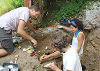 Dr. Eugene Morin and his students digging.